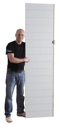 installer holding shower wall panel