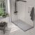 Frameless glass shower door enclosure