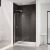 Walk-in glass shower shield door with brushed nickel hardware