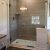 Cultured marble shower base with Marina Gray Oak laminate wall panels
