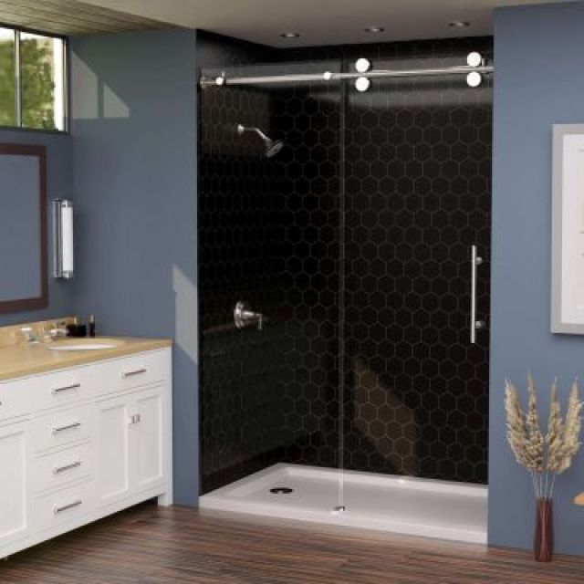 Sliding glass shower door system with black hexagon wall panels